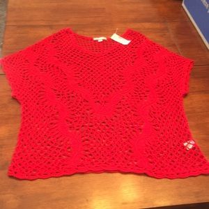 Sweater with knitted holes
